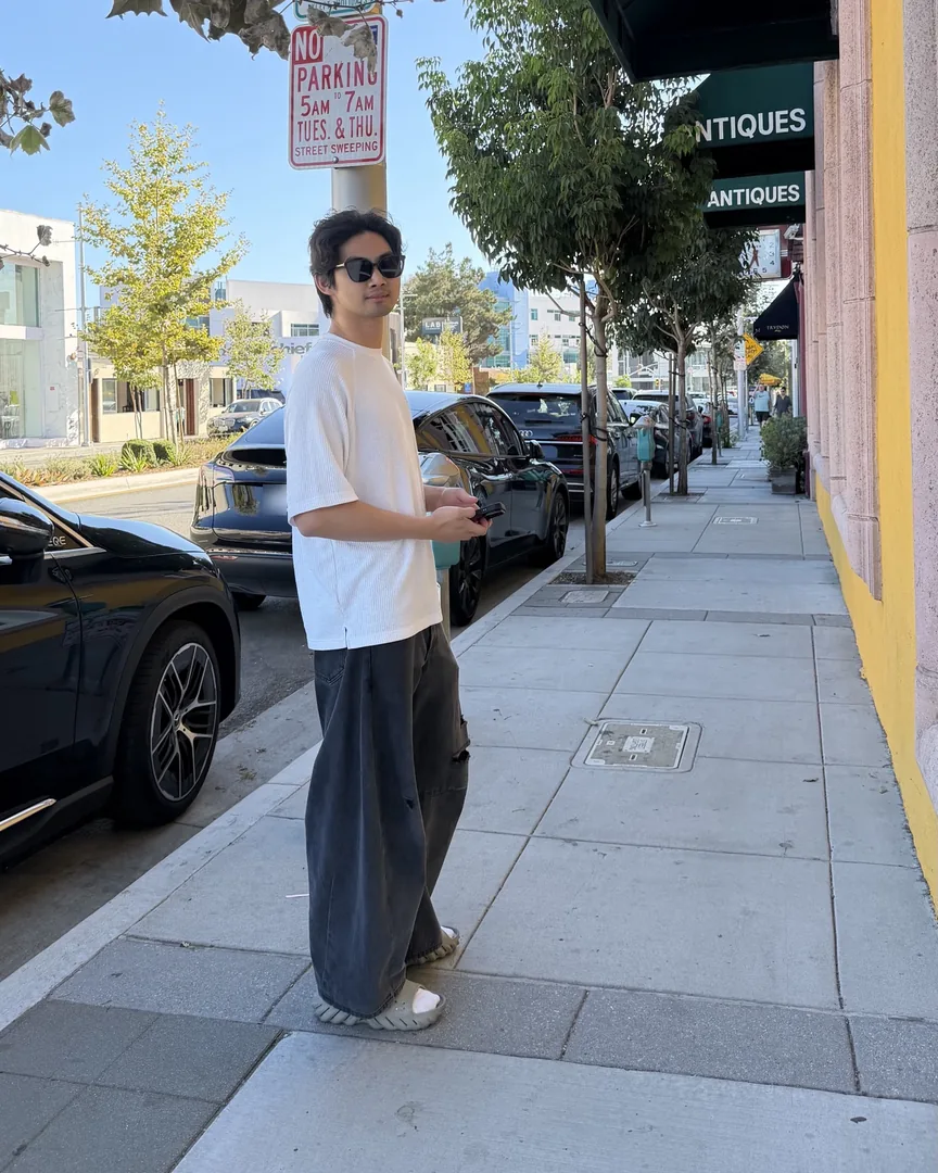 Howard standing on a sidewalk in Los Angeles